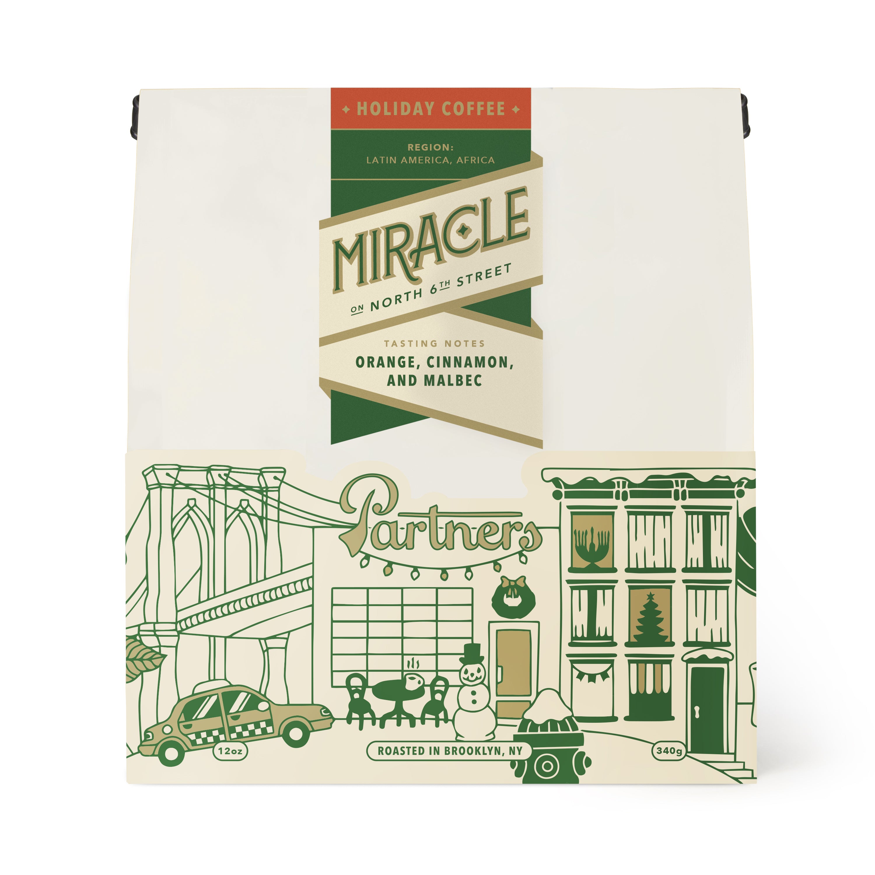 Front view of 12oz Miracle On North 6th St coffee bag showing holiday label with tasting notes of orange, cinnamon, and Malbec