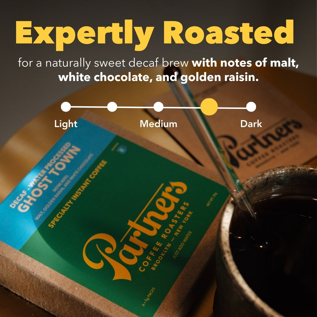 Promotional graphic showing medium-dark roast and tasting notes malt, white chocolate, golden raisin for Ghost Town Decaf