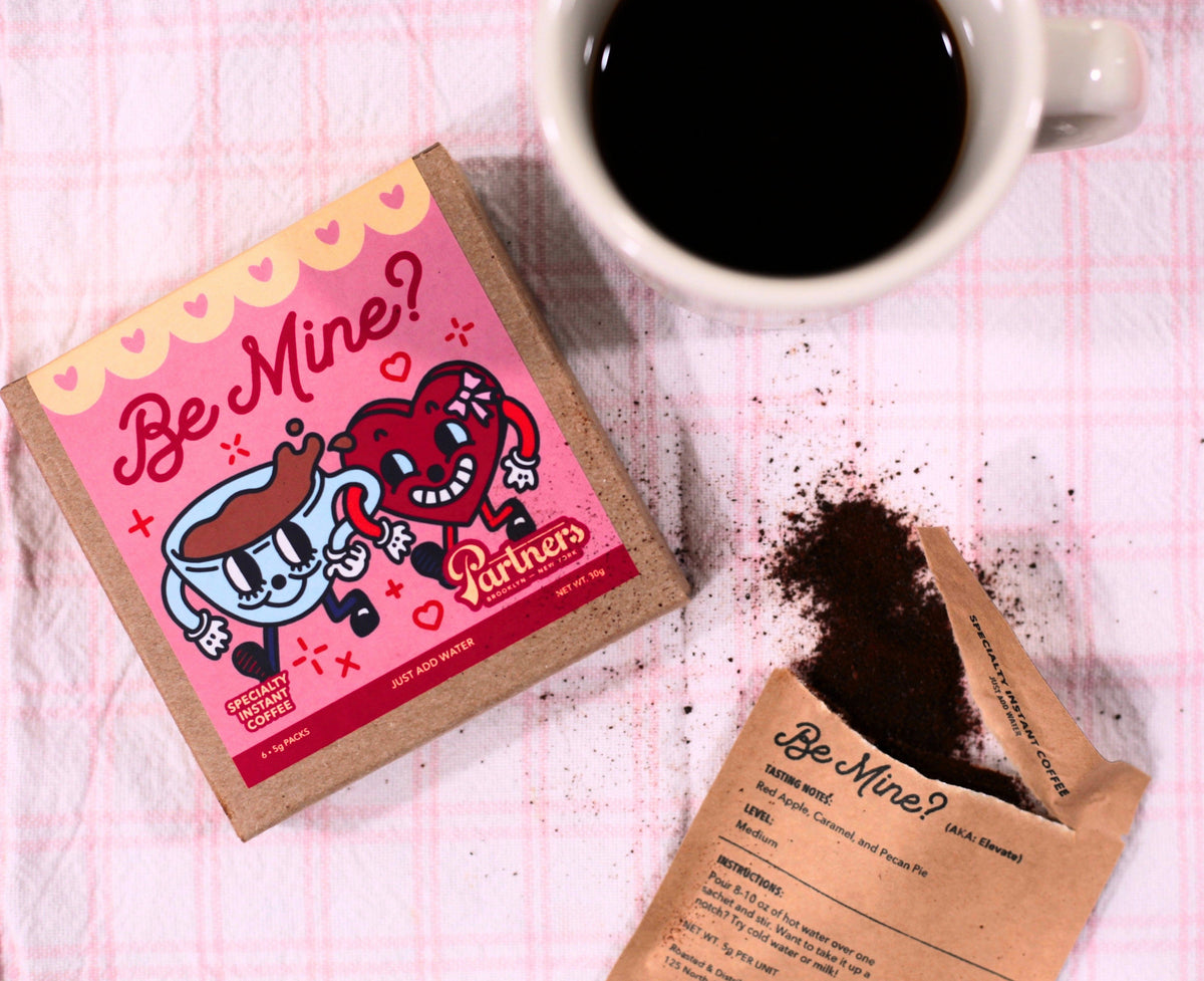 Image showing Partners Coffee's Be Mine? Specialty Instant Coffee, sachet with coffee, and a mug of brewed coffee