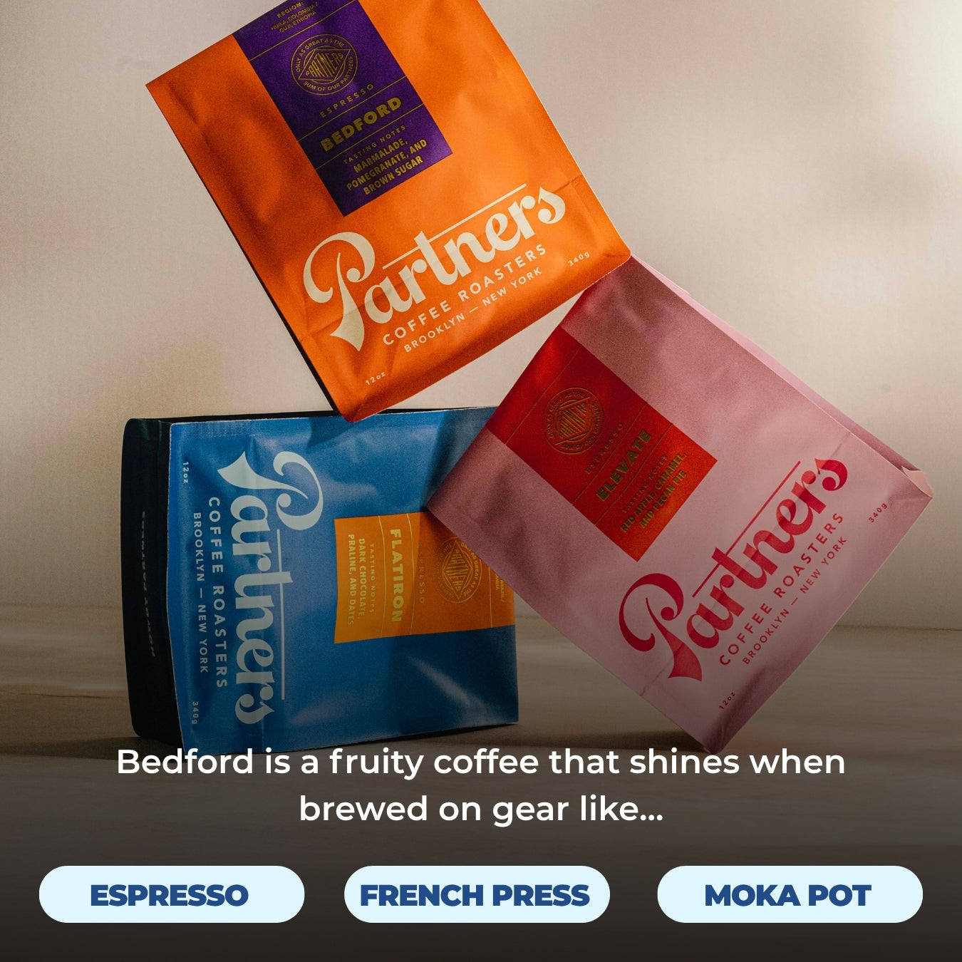 Three Partners Coffee bags with an orange Bedford bag on top and overlaid headline Bedford is a fruity coffee