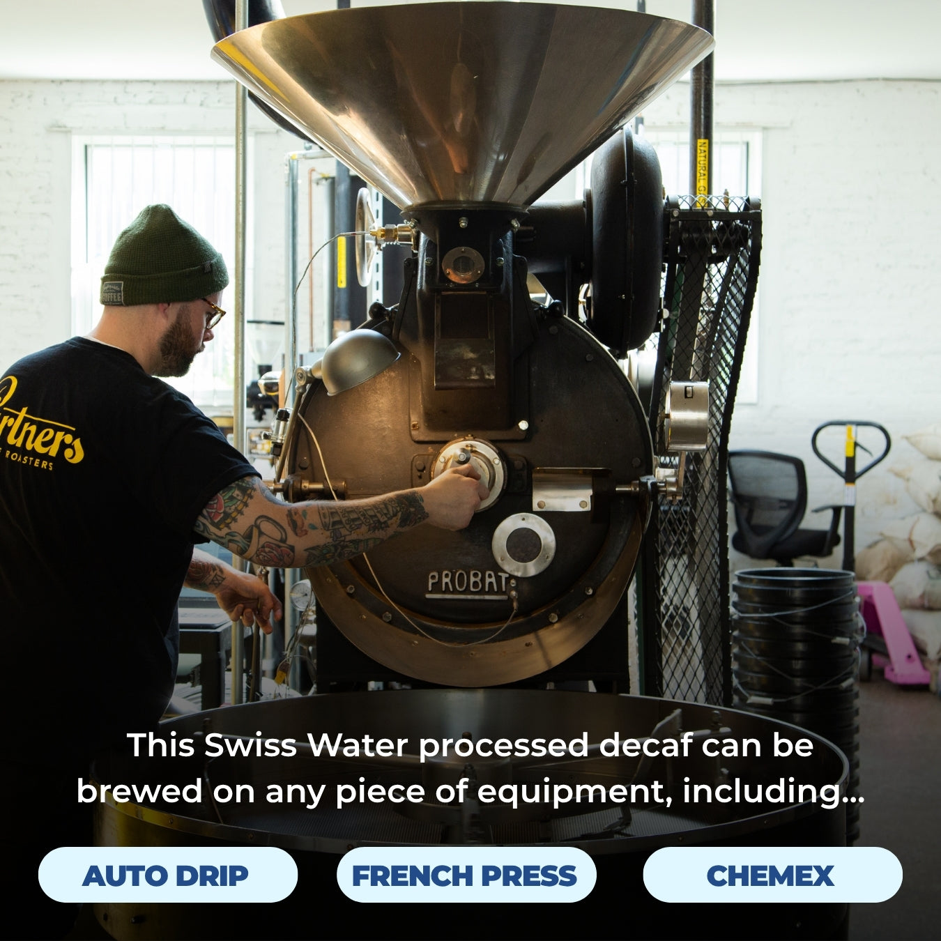 Worker adjusting a Probat coffee roaster; overlay: ‘This Swiss Water processed decaf can be brewed on any piece of equipment’