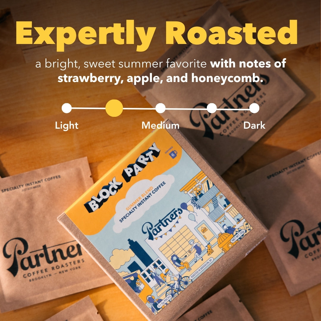 Angled view of Block Party instant coffee box with illustration, Expertly Roasted text, roast indicator, kraft sachets
