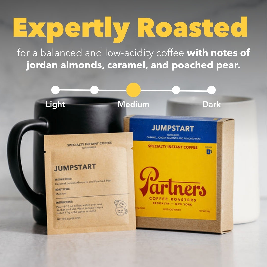 Front view of Jumpstart instant coffee box and pouch labeled Expertly Roasted highlighting medium roast and tasting notes