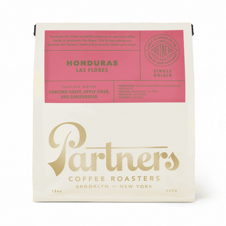 Front view of 12 oz Partners coffee bag showing Honduras Las Flores pink label and gold logo on white