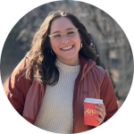 Miranda P. smiling in a red jacket