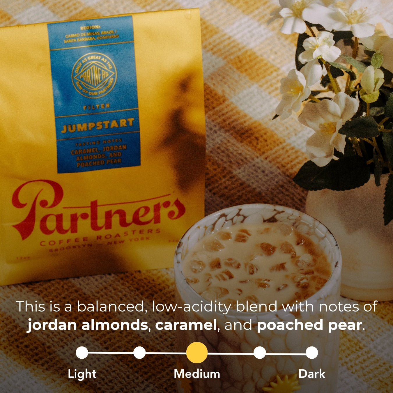 Photo showing flavor notes: balanced low-acidity with jordan almonds, caramel, and poached pear; roast level Medium