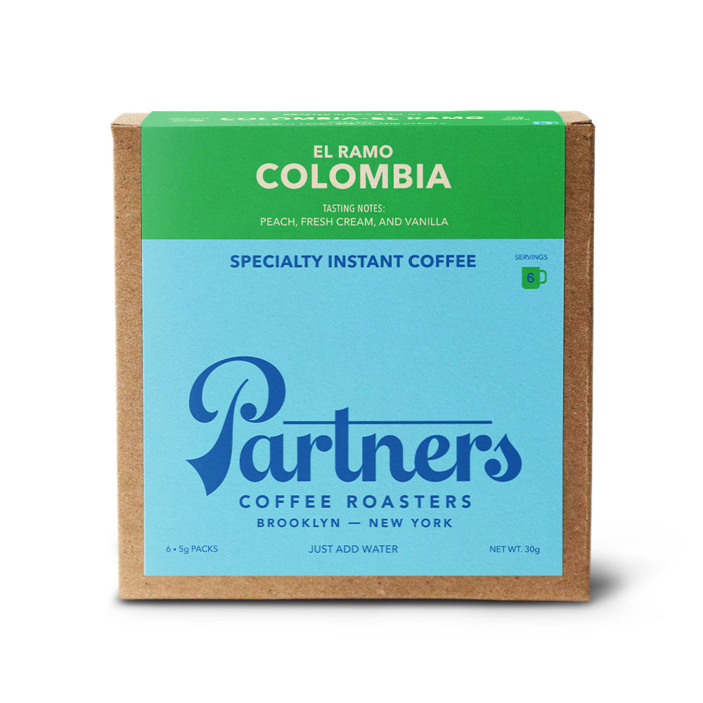 Front view of El Ramo Colombia specialty instant coffee box showing Partners logo and 6 servings badge on white background